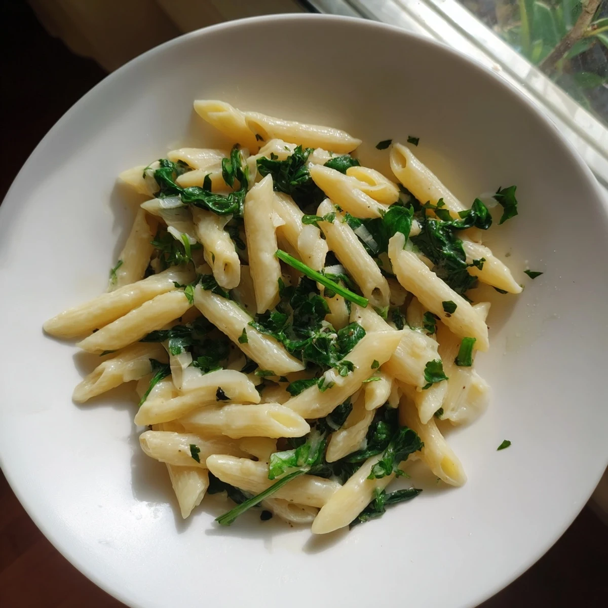 Tender pasta swimming in a rich sauce, showcased as The Magic Casserole: Creamy Spinach Pasta.
