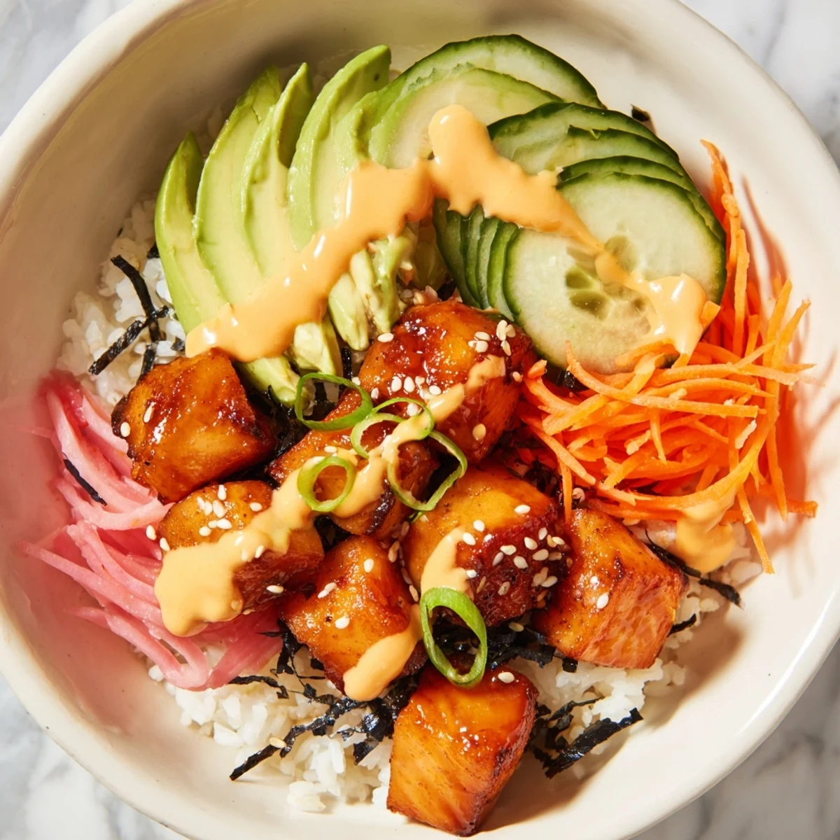 Golden, crispy salmon bites in a bowl, a fresh and delicious meal served over rice.