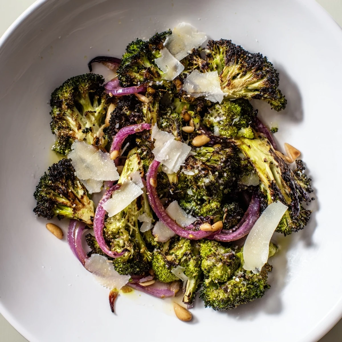 Close-up of a flavorful charred broccoli salad with Parmesan, perfect for a summer side dish.