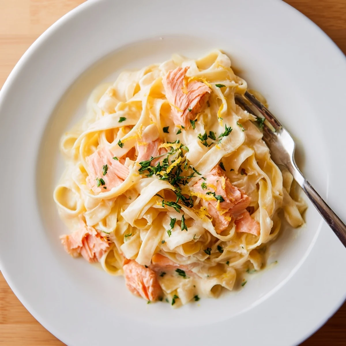 Flaky hot-smoked salmon folded into silky Creamy Salmon Pasta, served steaming on a plate with crusty bread.