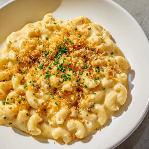 Golden Comfort Food mac and cheese, creamy and bubbly, ready to be served hot and delicious.