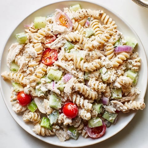 Everything Bagel Chicken Pasta Salad: a colorful display of pasta, chicken, and fresh veggies perfectly coated.