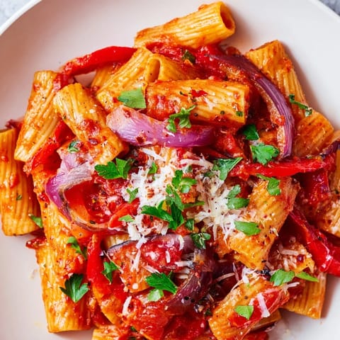 Vivid image of a plated bowl of fiery One-Pot Diavola Spicy Pasta, ready to serve and enjoy.