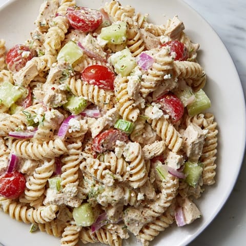 Cool, creamy Everything Bagel Chicken Pasta Salad, bursting with fresh flavors, ideal for a picnic.