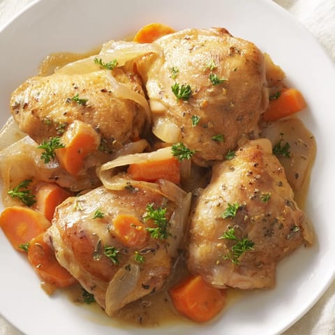 A close-up of the delicious Georgia Pot Roast Chicken, showcasing the juicy braised chicken and vegetables.