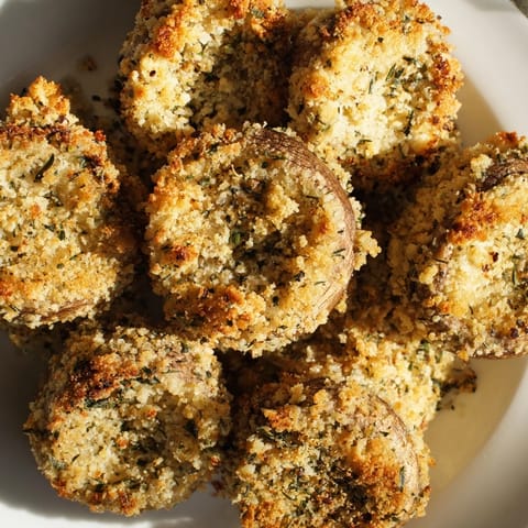 These delicious, oven-baked Ranch-Seasoned Crispy Mushrooms offer a satisfying crunch and savory, zesty flavor.