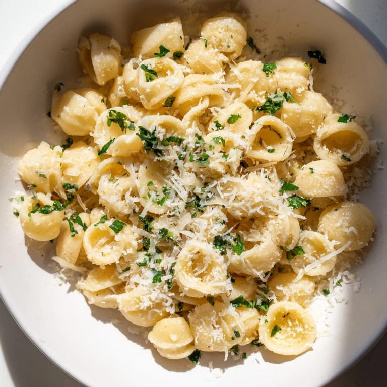 Comforting one-pot dish: rich 15-Minute Garlic Parmesan Pasta with garlic and creamy sauce.