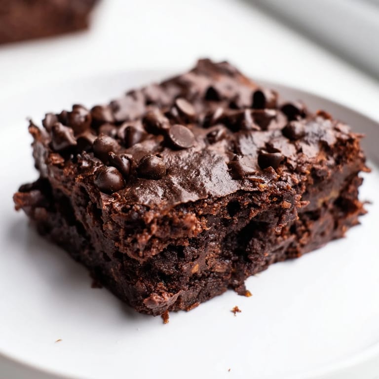 Homemade Greek Yogurt Brownies, cut into perfect squares, promising a rich, guilt-free indulgence.